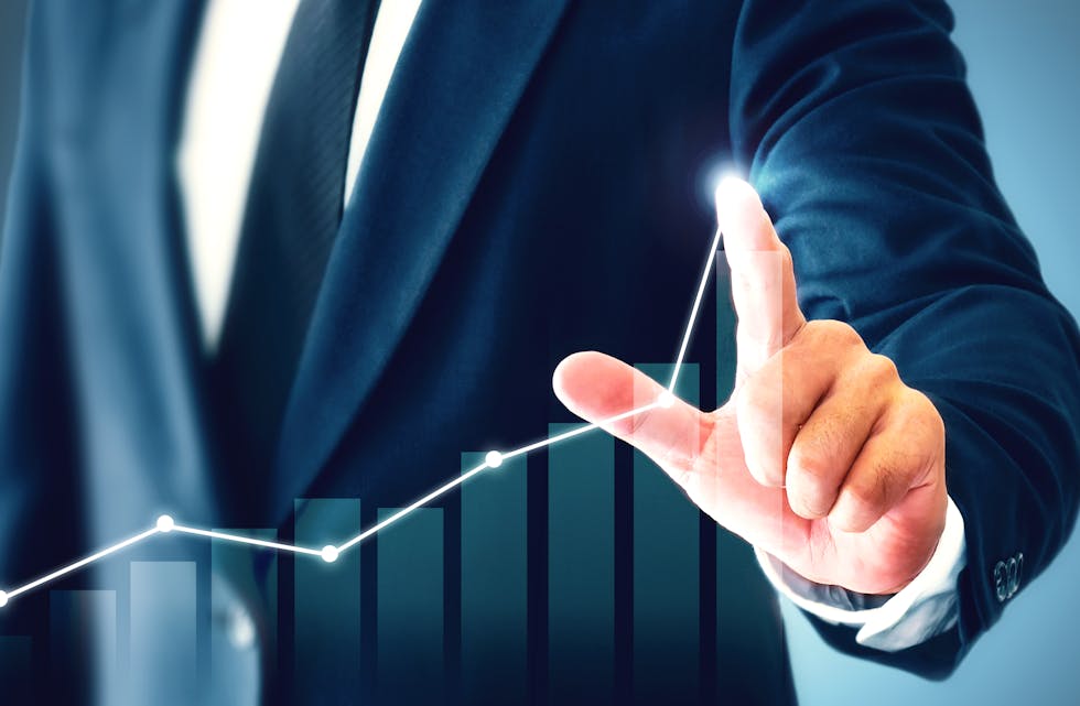 Businessman,Showing,Business,Growth,On,A,Chart,,Hands,Touch,The